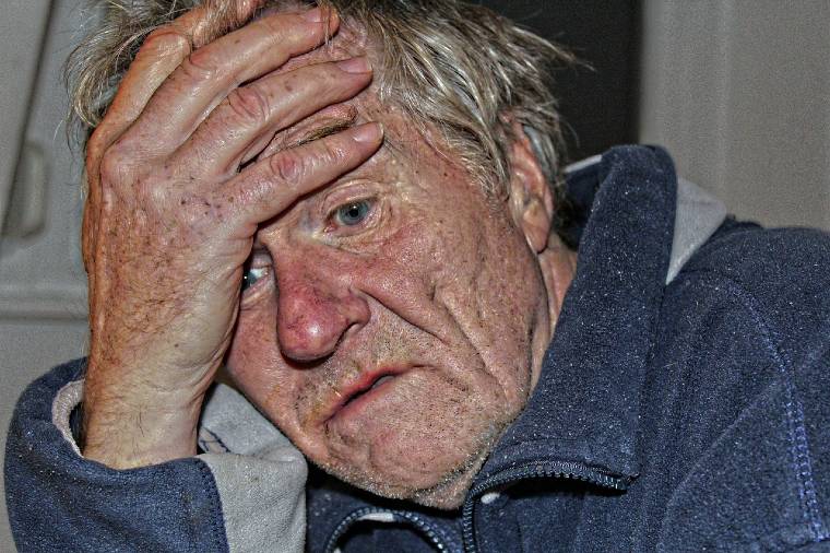 an old man in bad state of health